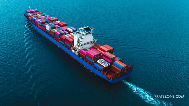 Aerial view of a container ship at sea. Fratezone’s tracking helps companies manage the 15% Section 122 tariff surcharge and protect EBITDA.